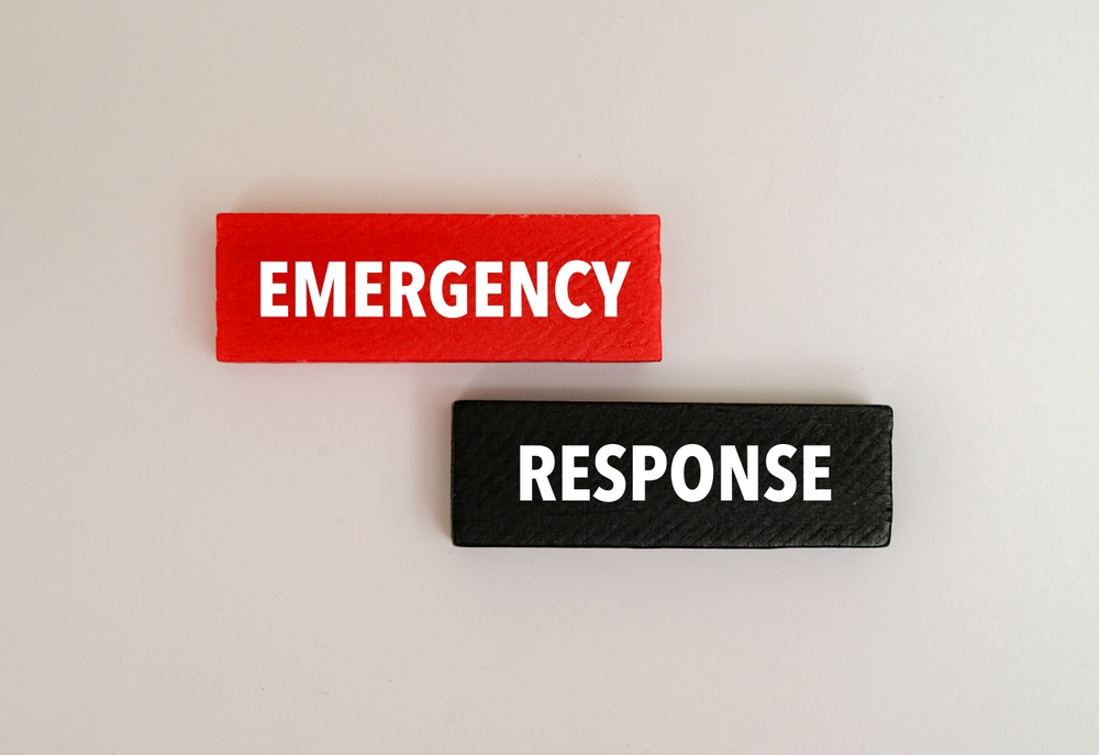 "Colored wooden block with the text 'EMERGENCY RESPONSE' printed on it."
