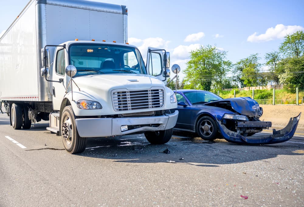 Truck accident with a car damaging vehicle