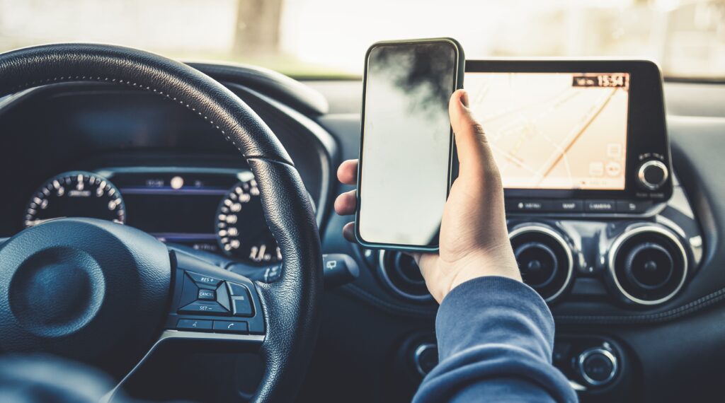 Car driver using mobile phone while driving