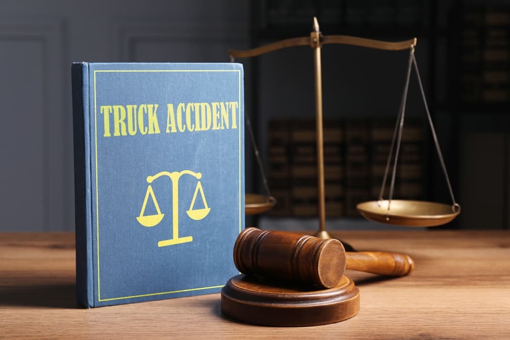 Truck Accident law book and gavel on the table