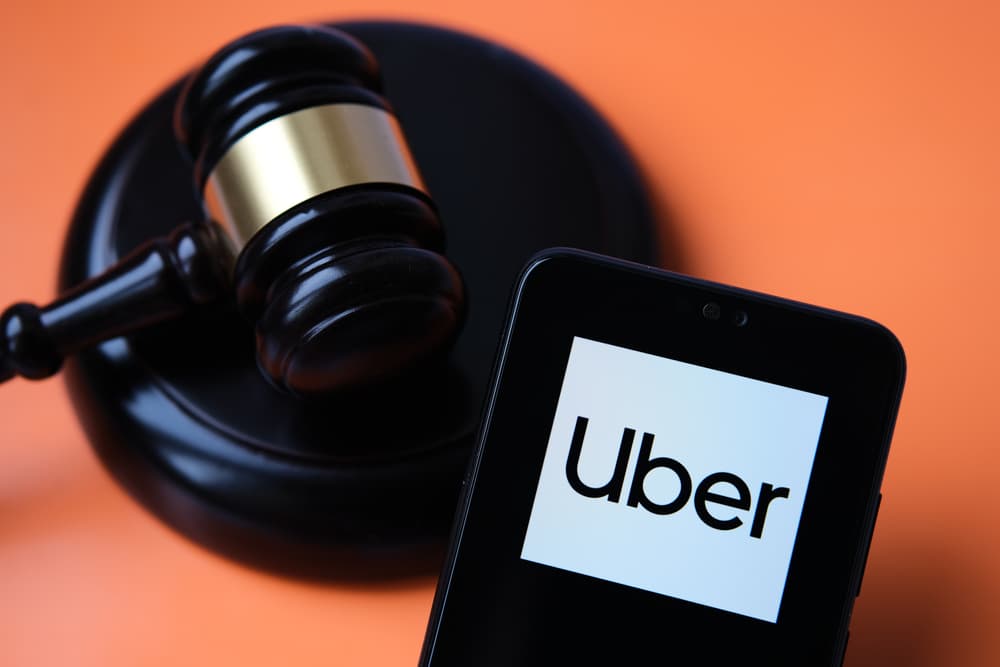 Judge's gavel and uber mobile app